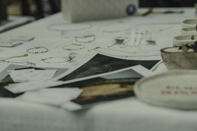 A close-up of various jewelry pieces elegantly displayed on a white table.